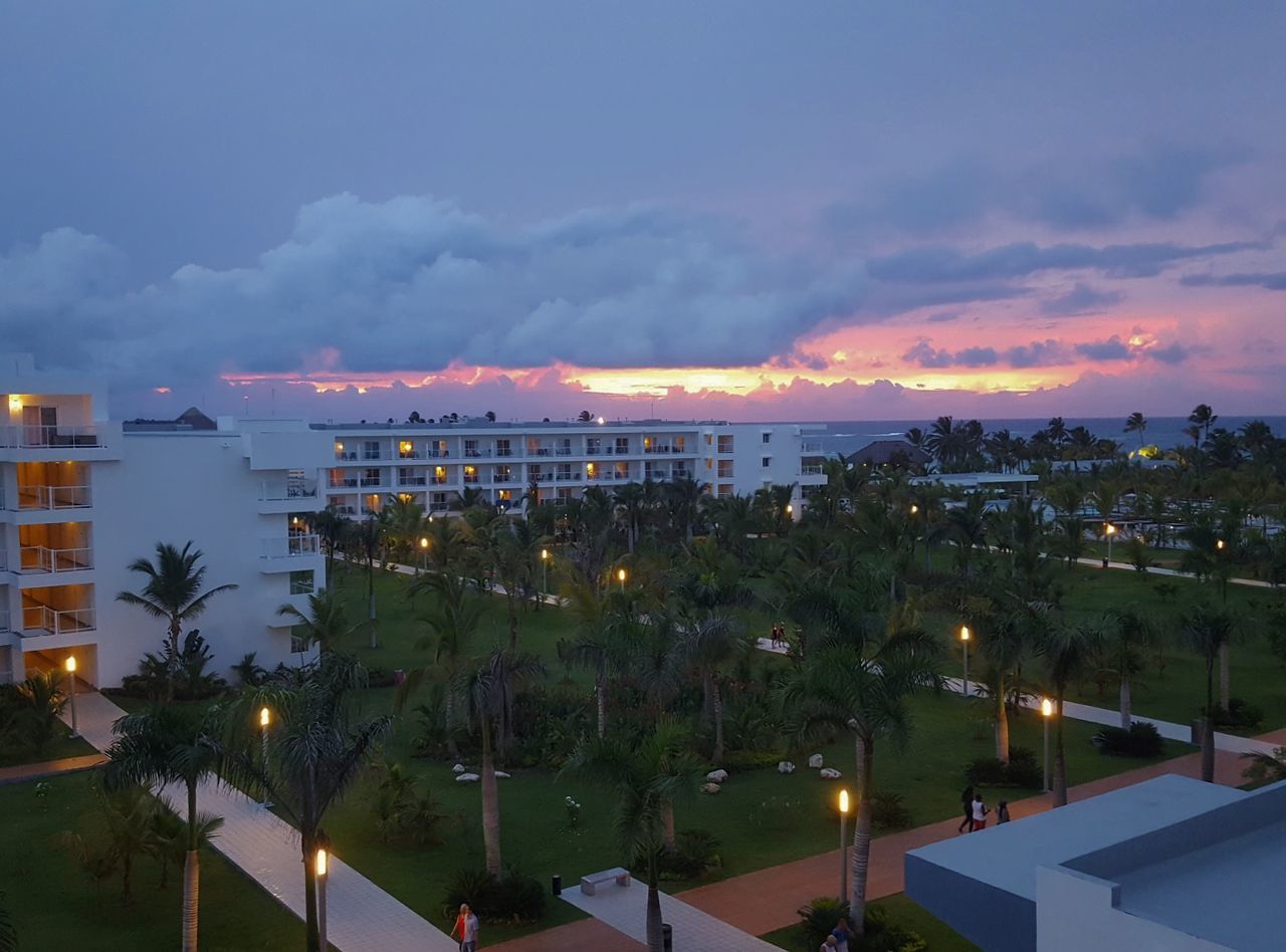 architecture, building exterior, built structure, sky, cloud - sky, no people, sunset, residential building, outdoors, tree, illuminated, cityscape, nature, water, city, beauty in nature, day