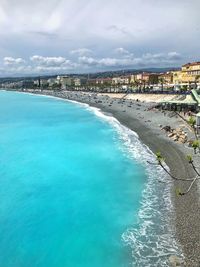 High angle view of swimming pool by sea against sky