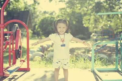 Portrait of boy standing in park