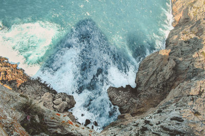 High angle view of rocks in sea