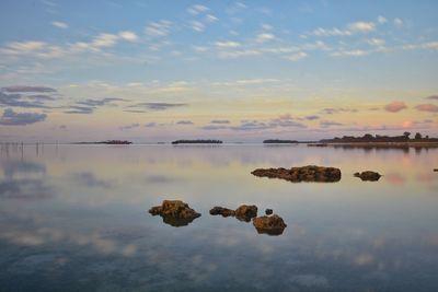 Scenic view of lake against sky during sunset