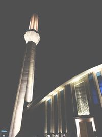 Low angle view of illuminated tower against sky