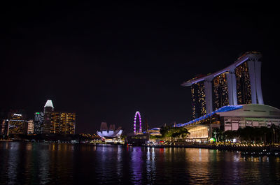 Illuminated buildings at waterfront