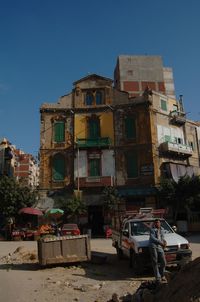 View of buildings in city against clear sky