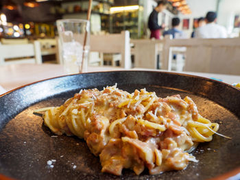 Close-up of pasta in plate on table
