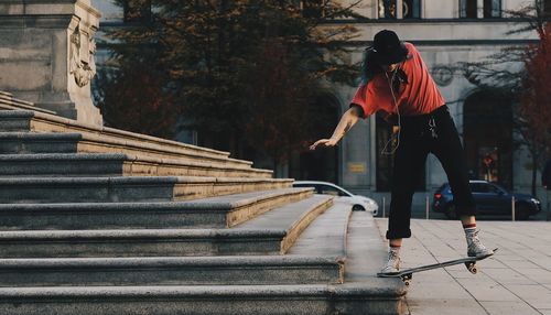 Rear view of woman on staircase