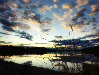 Scenic view of lake against sky during sunset