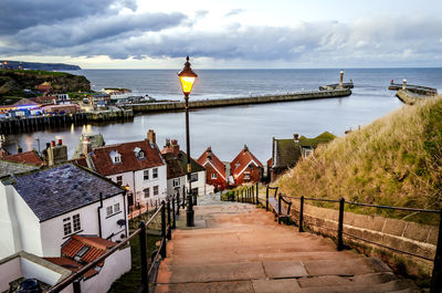 Scenic view of sea and buildings against sky