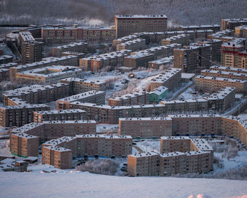 Aerial view of buildings in city during winter