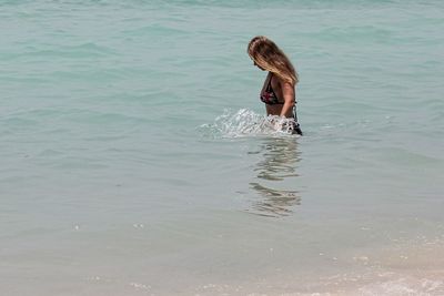 Woman swimming in sea