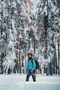 Portrait of woman skiing on snow