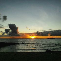 Scenic view of sea against sky at sunset