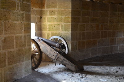 Cart in brick wall