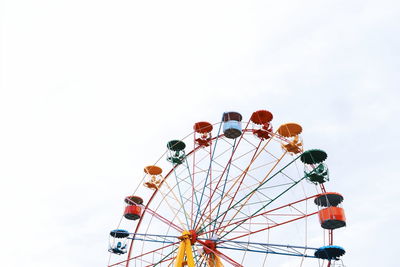 Low angle view of ferris wheel against sky