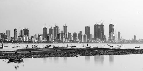 View of modern buildings in city against clear sky