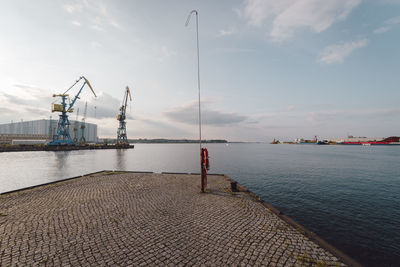 Man standing by sea against sky