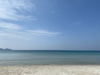 Scenic view of sea against blue sky