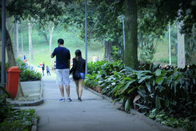 Full length of woman walking on footpath