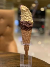Close-up of ice cream cone on table