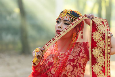 Portrait of woman with red umbrella
