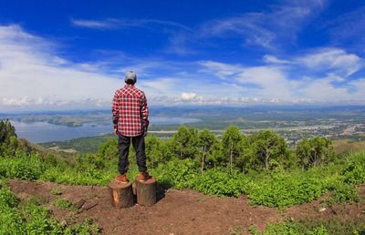 Scenic view of landscape against cloudy sky