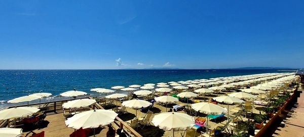 Scenic view of sea against clear blue sky