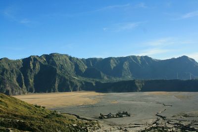 Scenic view of landscape and mountains against sky