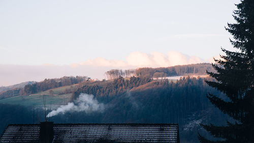 Scenic view of mountains against sky during winter