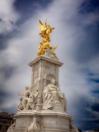 Low angle view of statue against sky