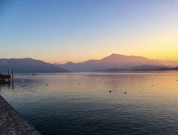 Scenic view of sea against clear sky during sunset