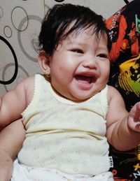 Portrait of cute baby girl at home