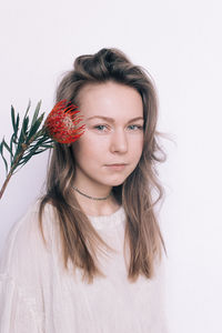 Portrait of a beautiful young woman over white background