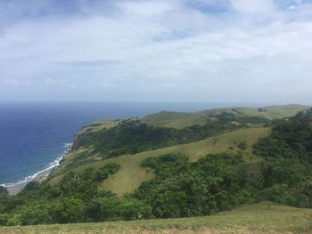 Scenic view of sea against cloudy sky