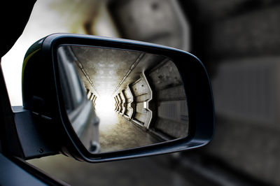 Close-up of side-view mirror of car