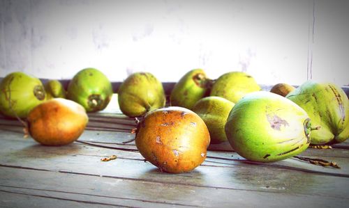 Close-up of coconuts on table