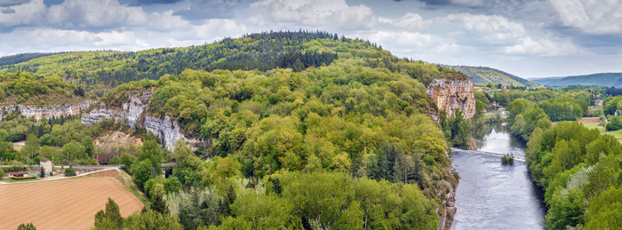 Panoramic view of green landscape against sky