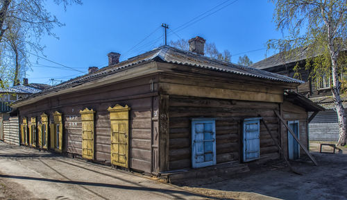 Low angle view of old building against blue sky