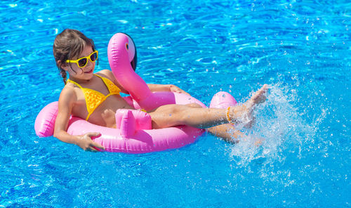 Woman swimming in pool