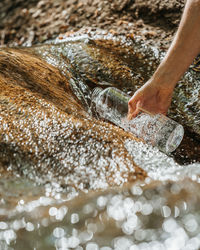 Person hand in water
