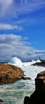 Scenic view of sea against cloudy sky