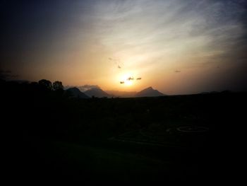 Scenic view of silhouette landscape against sky during sunset