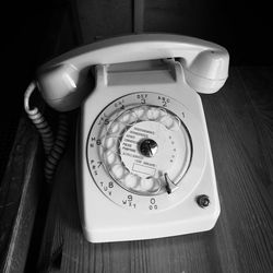 High angle view of telephone booth on table