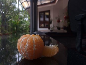 Close-up of orange slice on table