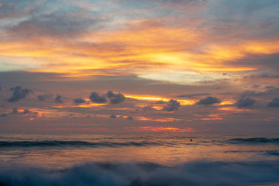 Scenic view of dramatic sky during sunset