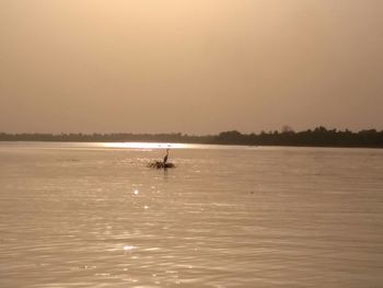 Scenic view of calm sea at sunset