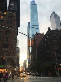 City street and modern buildings against sky