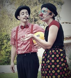 Young couple standing outdoors