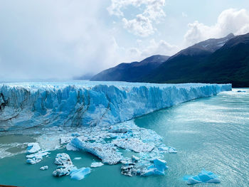 Scenic view of frozen lake against sky