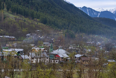 Scenic view of river amidst buildings