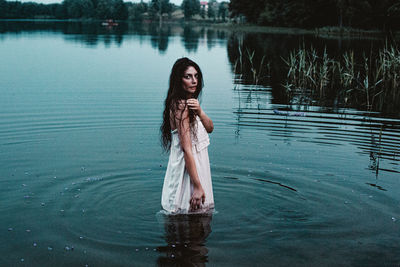 Woman standing in lake